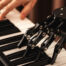 Man hand and robot hand on piano keys