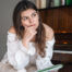 Woman pianist with a book thinking