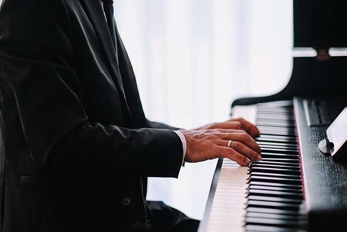 Pianist demonstrating arm weight and finger strength in piano playing